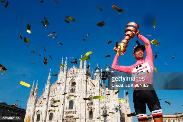 The winner of the 100th Giro d'Italia, Tour of Italy cycling race, Netherlands' Tom Dumoulin of team Sunweb holds the trophy on the podium near...