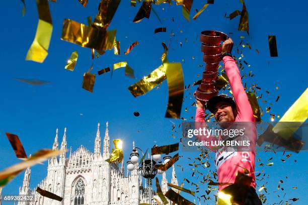 The winner of the 100th Giro d'Italia, Tour of Italy cycling race, Netherlands' Tom Dumoulin of team Sunweb holds the trophy on the podium near...