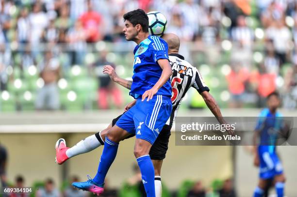 Fabio Santos of Atletico MG and Leo Arthur of Ponte Preta battle for the ball during a match between Atletico MG and Ponte Preta as part of...