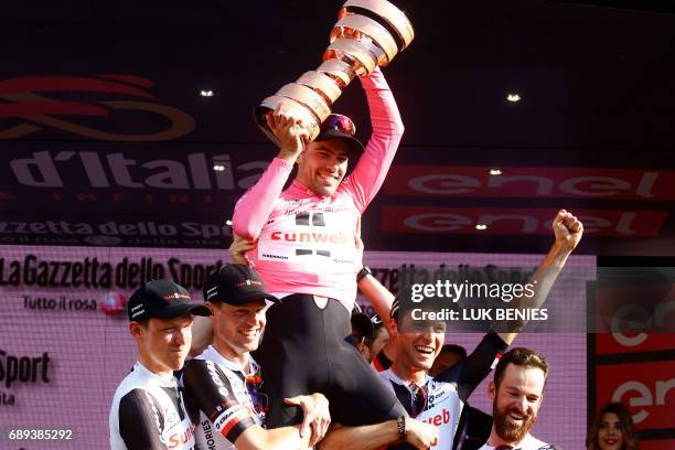 The winner of the 100th Giro d'Italia, Tour of Italy cycling race, Netherlands' Tom Dumoulin of team Sunweb celebrates with teammates on the podium...