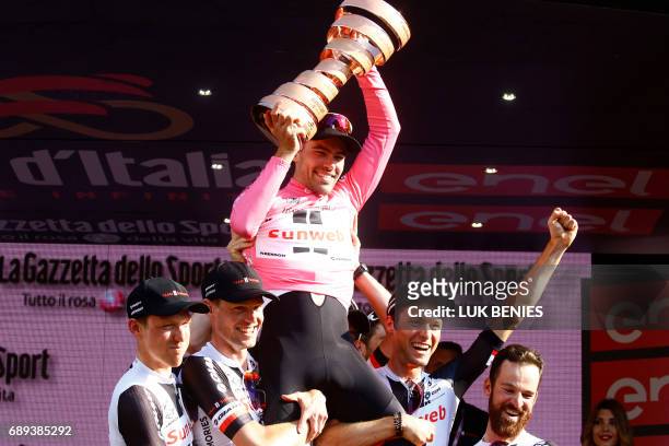 The winner of the 100th Giro d'Italia, Tour of Italy cycling race, Netherlands' Tom Dumoulin of team Sunweb celebrates with teammates on the podium...