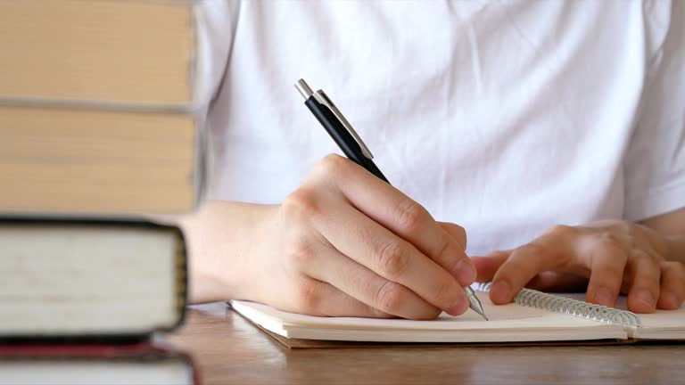 Writing Notebook Stack 112 Writing Stack Of Paper Desk Stock Videos, Footage, & 4K Video Clips ...