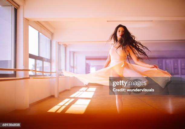 beautiful female dancer dancing classical ballet in dance studio - teen girls toes stock pictures, royalty-free photos & images