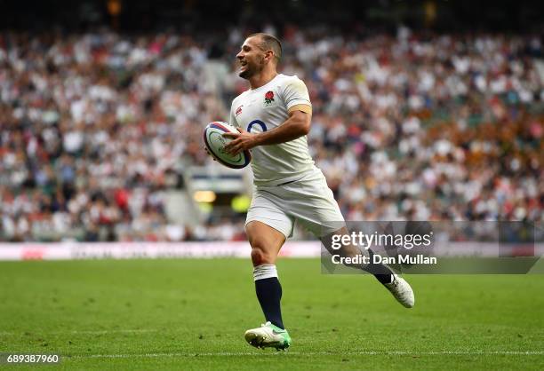 Danny Care of England makes a break to score his side's third try during the Old Mutual Wealth Cup match between England and The Barbarians at...