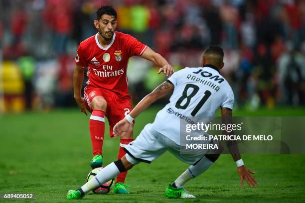 Benfica's midfielder Pizzi Fernandes vies with Vitoria de Guimaraes' Brazilian forward Rafinha during the Portugal's Cup final football match SL...