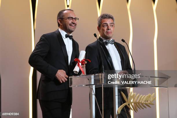 Russian director Andrey Zvyagintsev smiles on stage after he was awarded with the Jury Prize for the film 'Loveless' on May 28, 2017 during the...