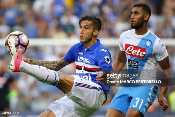 Sampdoria's midfielder Ricardo Gabriel Alvarez from Argentina fights for the ball with Napoli's defender Faouzi Ghoulam from Algeria during the...
