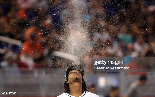 Jose Urena of the Miami Marlins spits water during a game against the Los Angeles Angels at Marlins Park on May 28, 2017 in Miami, Florida.