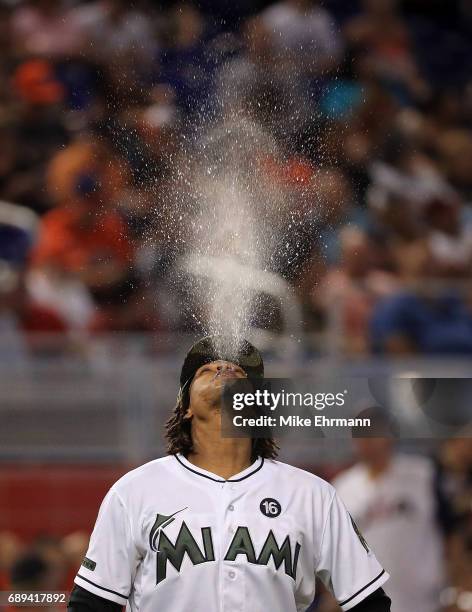 Jose Urena of the Miami Marlins spits water during a game against the Los Angeles Angels at Marlins Park on May 28, 2017 in Miami, Florida.