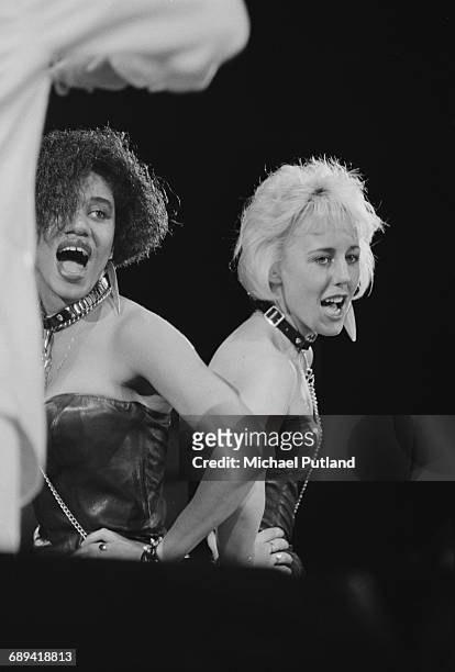 Backing singers Pepsi and Shirlie, performing with pop duo Wham! Wham!, during 'The Big Tour', Japan, 1985. Left to right: Helen DeMacque and Shirlie...