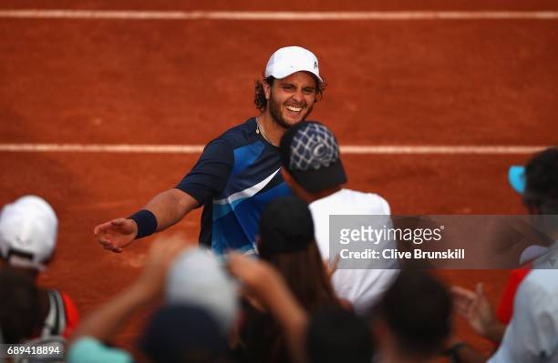 Marco Trungelliti of Argentina celebrate victory over Quentin Halys of France in the mens singles first round match on day one of the 2017 French...