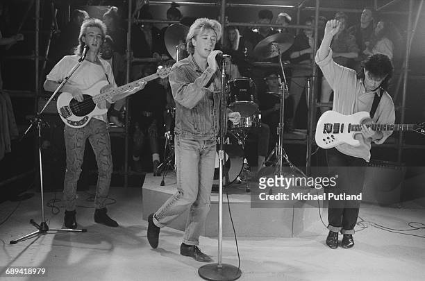 Australian pop/funk group Wa Wa Nee performing on a TV show, 24th June 1987. Left to right: Mark Gray, Paul Gray, Chris Sweeney and Steve Williams.