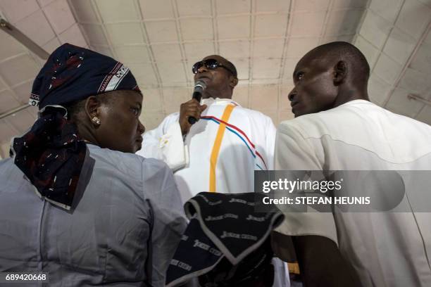 Father Charles Ubawuike preaches during a service at the St. Martin of Tours Catholic Church in the Aba-South district in Aba on May 28, 2017. The...