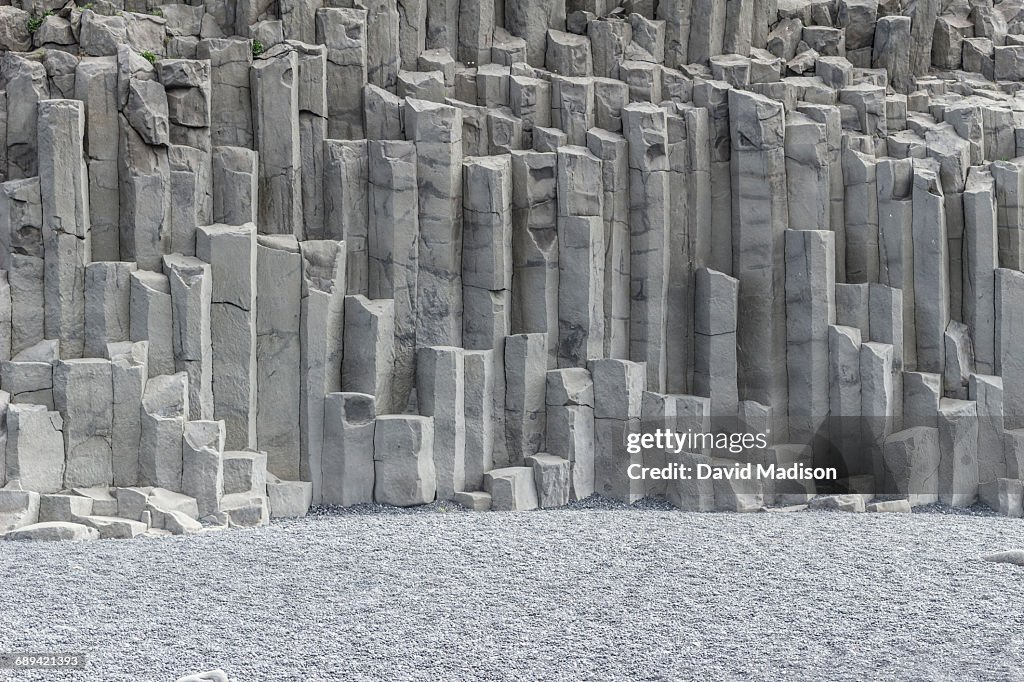 Basalt columns and black sand beach.