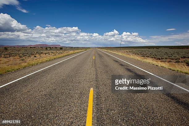 endless road in arizona - massimo pizzotti stock pictures, royalty-free photos & images