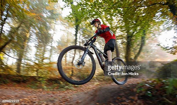 teenage boy mountain biking on the quantock hills. - bike stock pictures, royalty-free photos & images