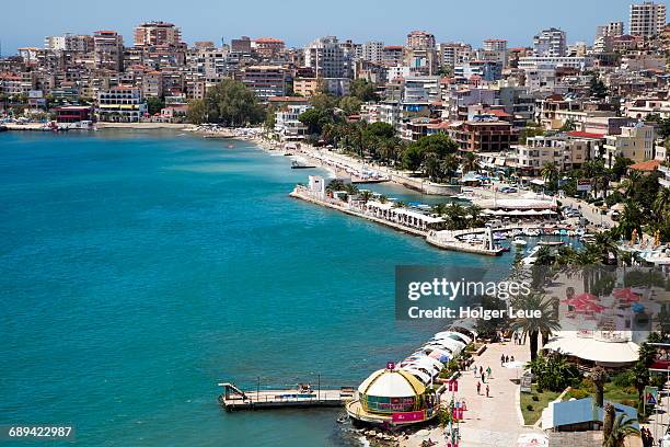 overhead of beach promenade and city - albania fotografías e imágenes de stock