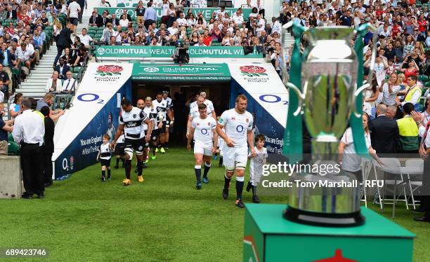 Chris Robshaw of England and Thierry Dusautoir of Barbarians lead out the teams during the Old Mutual Wealth Cup match between England and Barbarians...