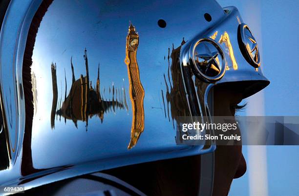 Big Ben and the British Houses of Parliament are reflected in the helmet of a member of the Troy High School Trojan Marching Band from Troy, Ohio...