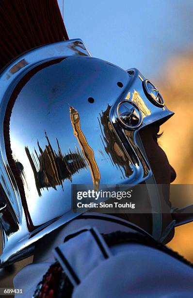 Big Ben and the British Houses of Parliament are reflected in the helmet of a member of the Troy High School Trojan Marching Band from Troy, Ohio...