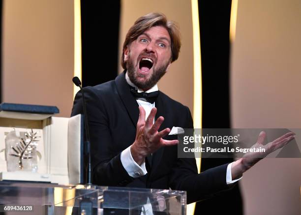 Director Ruben Ostlund celebrates on the stage after receiving the Palme d'Or for the movie "The Square" at the Closing Ceremony during the 70th...