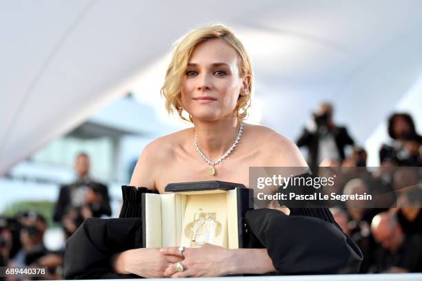 Diane Kruger winner of the award for best actress for her part in the movie "In The Fade" attends the Palme D'Or winner photocall during the 70th...