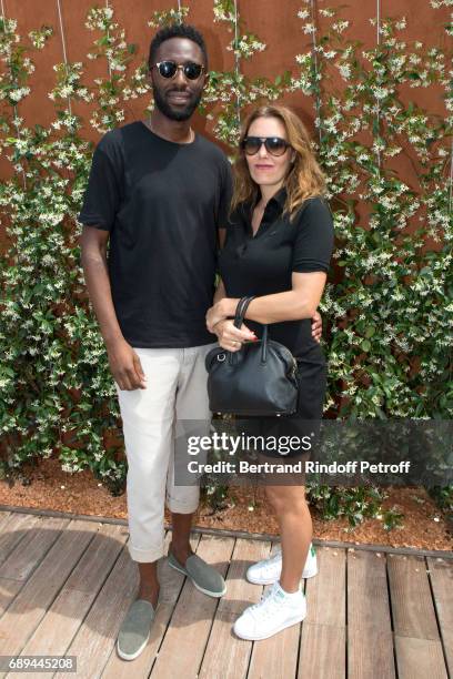 Humorist Thomas N'Gijol and actress Karole Rocher attend the 2017 French Tennis Open - Day One at Roland Garros on May 28, 2017 in Paris, France.