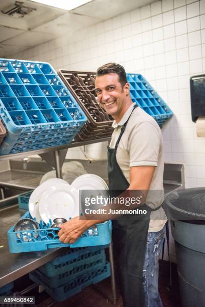 restaurant kitchen worker - restaurant cleaning stock pictures, royalty-free photos & images