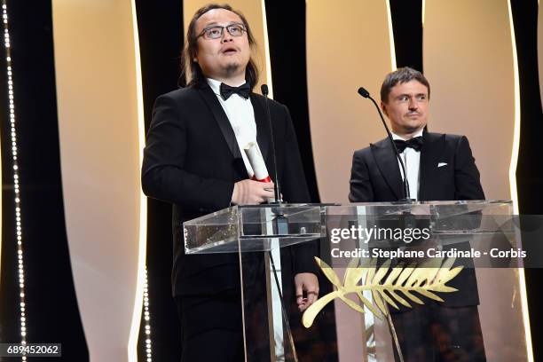 President of the Short Films and Cinefondation jury Cristian Mungiu hands over the award for Best Short for "A Gentle Night" to director Qiu Yang...