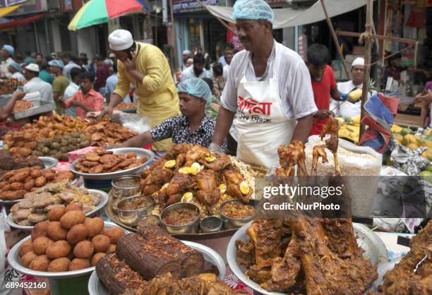 People gather to buy foods for breaking their fast during the Muslims holy fasting month of Ramadan at the traditional food market popular for...