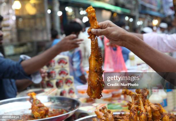 People gather to buy foods for breaking their fast during the Muslims holy fasting month of Ramadan at the traditional food market popular for...