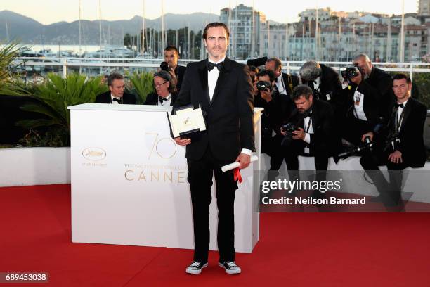 Joaquin Phoenix winner of the award for Best Actor for his part in the movie "You Were Never Really Here" attends the Palme D'Or winner photocall...