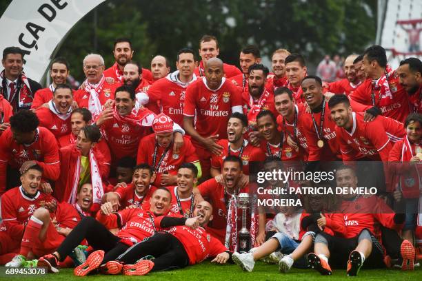 Benfica's team poses for a photo with the trophy at the end of the Portugal's Cup final football match SL Benfica vs Vitoria SC at Jamor stadium in...