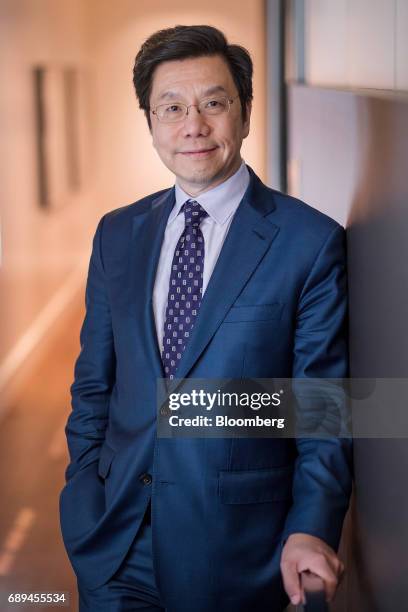 Kai-fu Lee, founder and chief executive officer of Sinovation Ventures, stands for a photographer after a Bloomberg Technology interview in San...