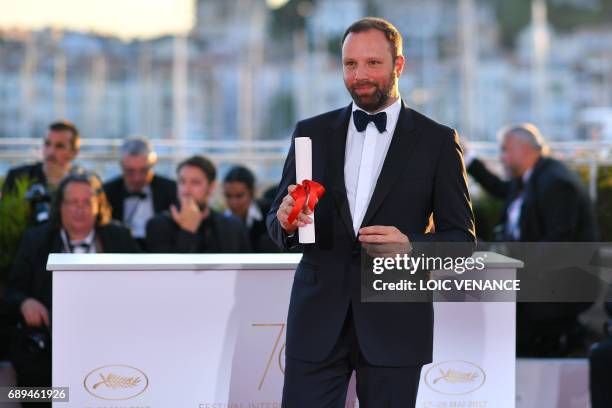 Greek director Yorgos Lanthimos poses during a photocall on May 28, 2017 after he won won the Best Screenplay prize for his film 'The Killing of a...