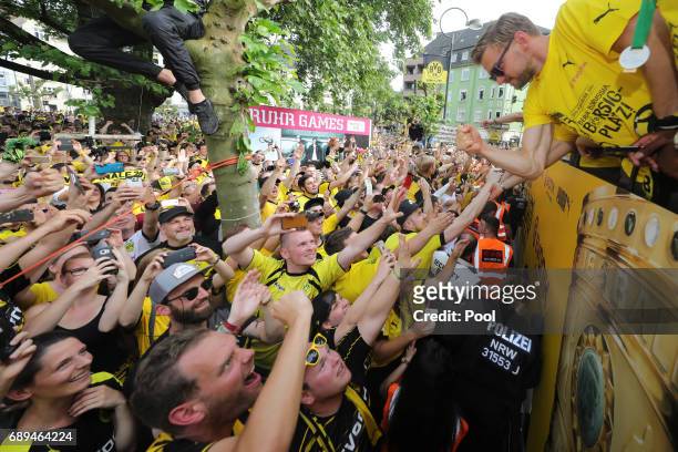 Marcel Schmelzer of Borussia Dortmund greets fans as the team celebrates during a winner's parade at Borsigplatz on May 28, 2017 in Dortmund, Germany.