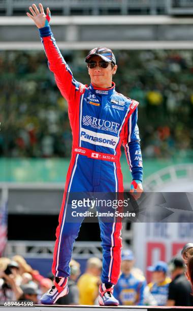 Takuma Sato of Japan, driver of the Andretti Autosport Honda, waves to the crowd during driver introductions ahead of the 101st running of the...