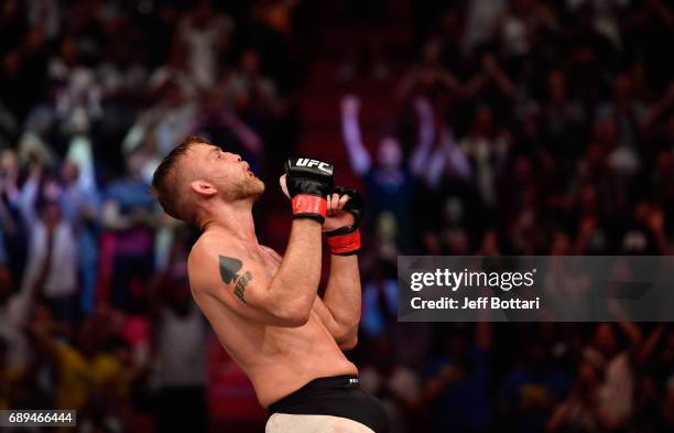 Alexander Gustafsson celebrates his knockout victory over Glover Teixeira in their light heavyweight fight during the UFC Fight Night event at the...