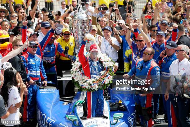 Takuma Sato of Japan, driver of the Andretti Autosport Honda, celebrates in Victory Lane after winning the 101st running of the Indianapolis 500 at...