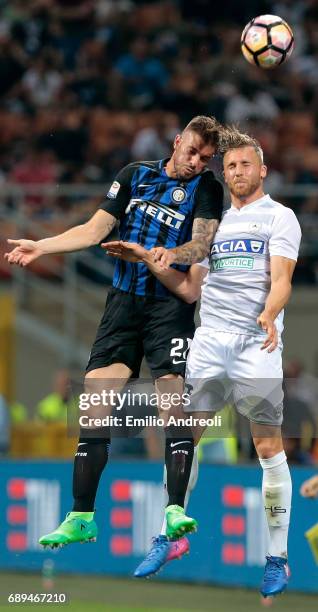 Davide Santon of FC Internazionale Milano jumps for the ball with Silvan Widmer of Udinese Calcio during the Serie A match between FC Internazionale...