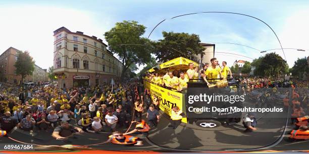 Julian Weigl celebrates on the bus with the trophy during a parade near Borsigplatz for the celebrations of Borussia Dortmund's DFB Cup win on May...