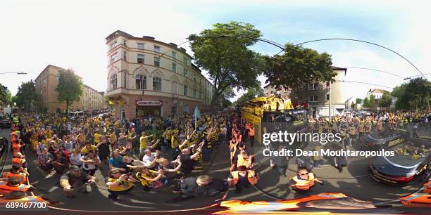 Julian Weigl celebrates on the bus with the trophy during a parade near Borsigplatz for the celebrations of Borussia Dortmund's DFB Cup win on May...