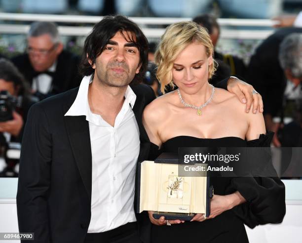 German actress Diane Kruger poses with her director Fatih Akin during the Award Winners photocall after she won the Best Actress Prize for Aus dem...