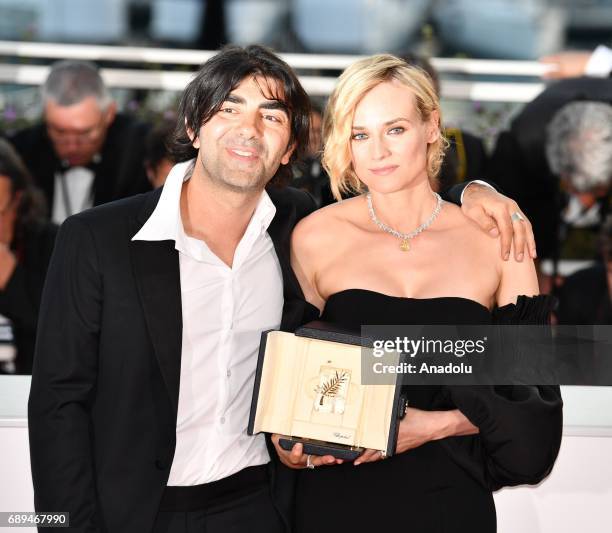 German actress Diane Kruger poses with her director Fatih Akin during the Award Winners photocall after she won the Best Actress Prize for Aus dem...