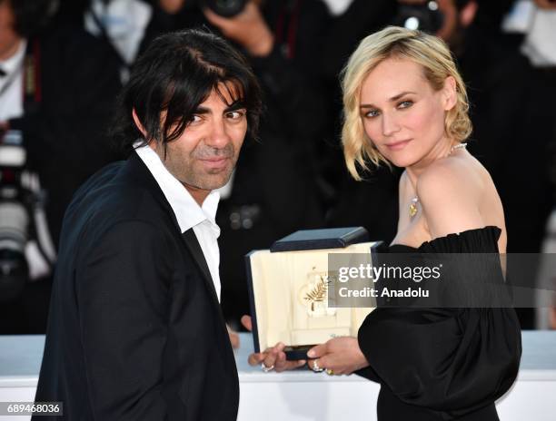 German actress Diane Kruger poses with her director Fatih Akin during the Award Winners photocall after she won the Best Actress Prize for Aus dem...