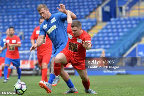 May 28: TOWIE's Dan Osborne in action with Eastender's Danny Boy Hatchard during the Celebrity Charity Football Match at King Power Stadium on May 28...