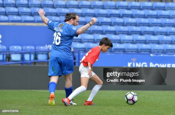 May 28: Junior Andre in action Thomas Sellers during the Celebrity Charity Football Match at King Power Stadium on May 28 , 2017 in Leicester, United...