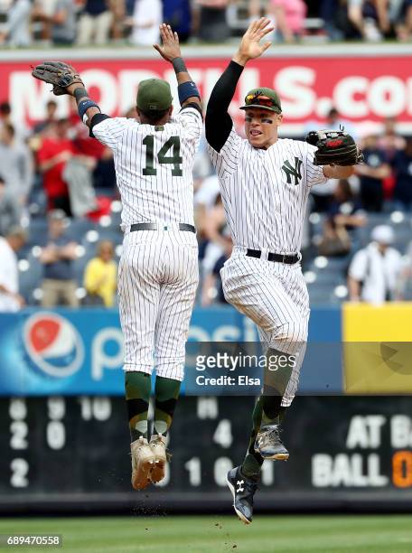 Starlin Castro and Aaron Judge of the New York Yankees celebrate the 9-5 win over the Oakland Athletics on May 28, 2017 at Yankee Stadium in the...