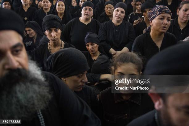 Prayers in 'Deir El-Garnouse Coptic church , near Al-Minya for the victims of of a terrorist attack. The prayers used to made in the homes of each...