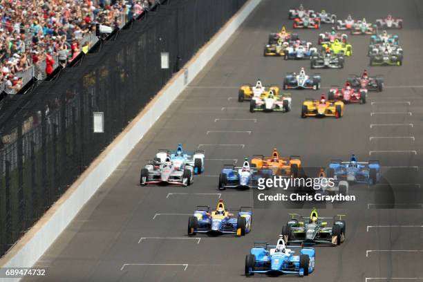 Scott Dixon of New Zealand, driver of the Camping World Honda, leads the field during during the 101st Indianapolis 500 at Indianapolis Motorspeedway...